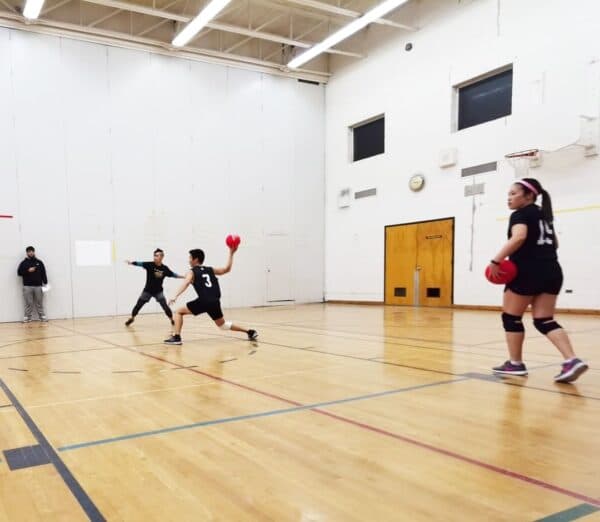 ATHL33T players mid-throw during a league night